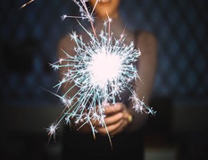 Women holding a sparkler for non-traditional retail events